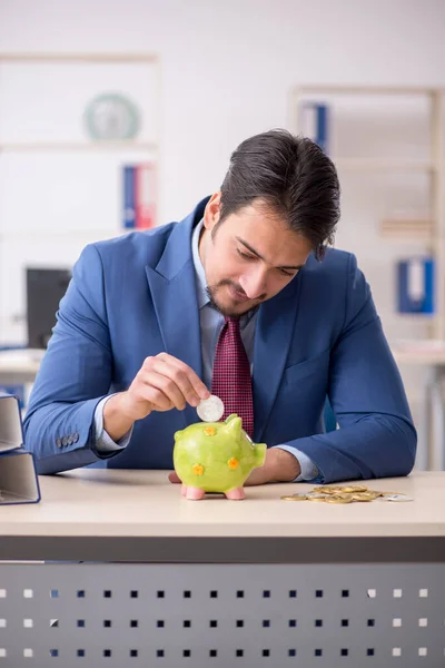 Young man earning money via Internet in retirement concept — Stock Photo, Image