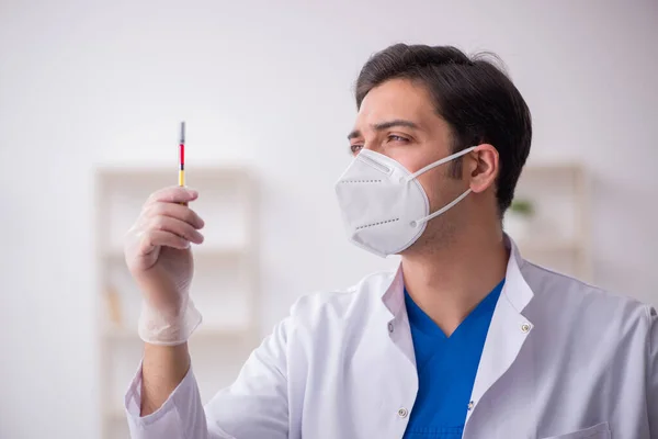 Young male doctor in vaccination concept — Stock Photo, Image