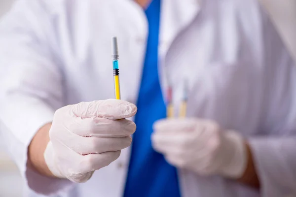 Young male doctor in vaccination concept — Stock Photo, Image