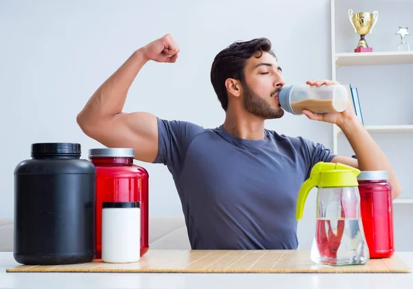 Athlete tasting new protein supplements for better muscles — Stock Photo, Image