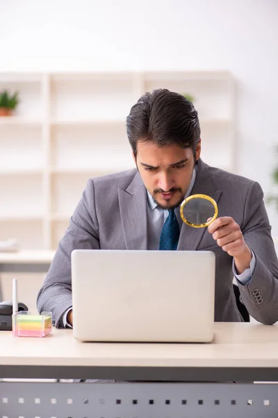 Young male auditor working in the office — Stock Photo, Image