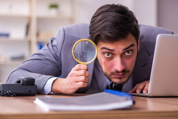 Young handsome auditor working in the office — Stock Photo, Image