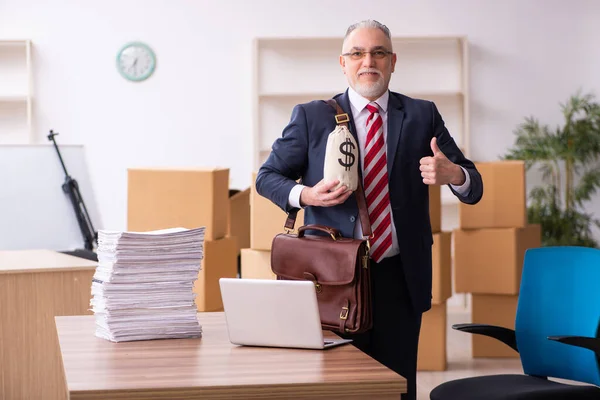 Old businessman employee in relocation concept