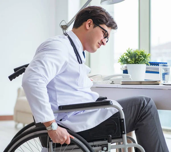 Disabled doctor on wheelchair working in hospital