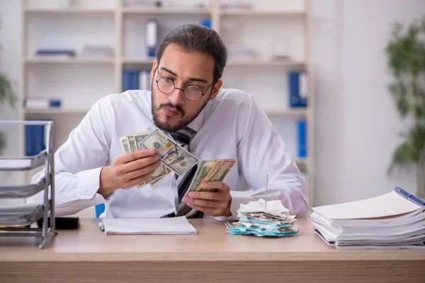 Young male bookkeeper in budget planning concept — Stock Photo, Image