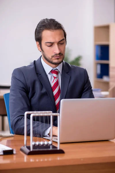 Young man businessman employee sitting in the office — Stock Photo, Image