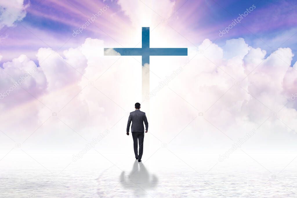 Religious concept with cross and lonely man