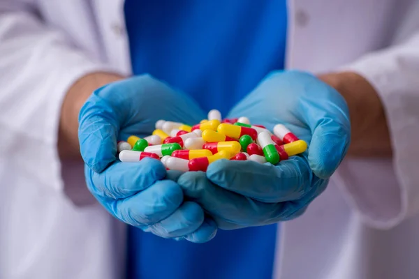 Young male doctor and too many pills — Stock Photo, Image