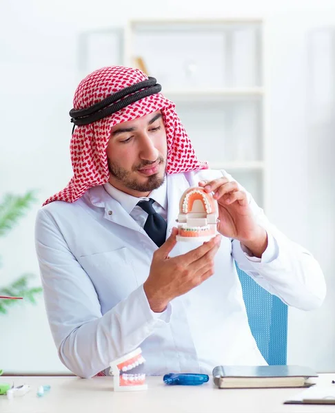 Arab dentist working on new teeth implant — Stock Photo, Image