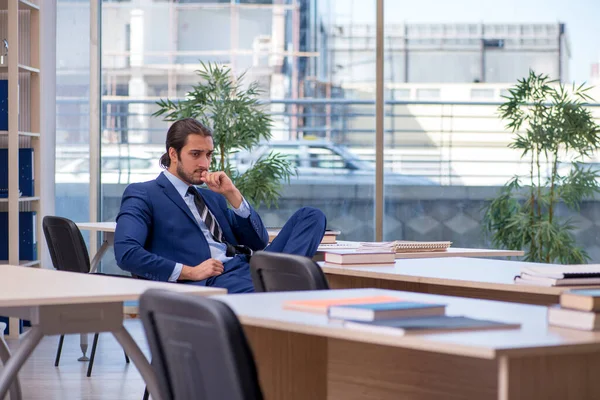 Young male teacher in suit in the classroom — Stock Photo, Image