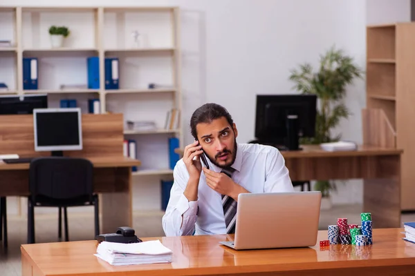 Young male employee in gambling concept — Stock Photo, Image