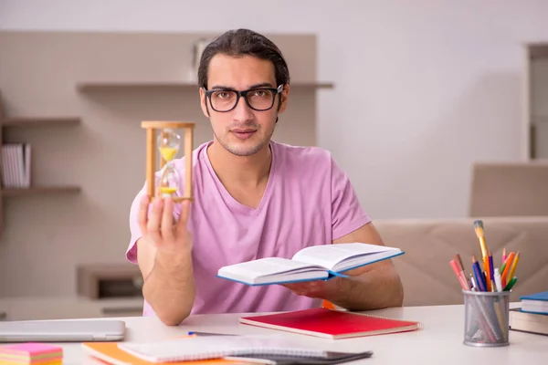 Young male student in time management concept — Stock Photo, Image