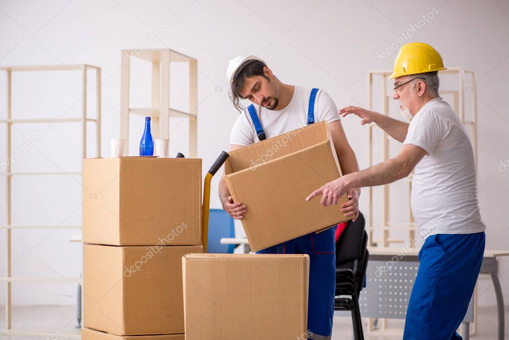 Two drunken professional movers doing home relocation