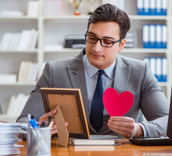 Businessman feeling love and loved in the office