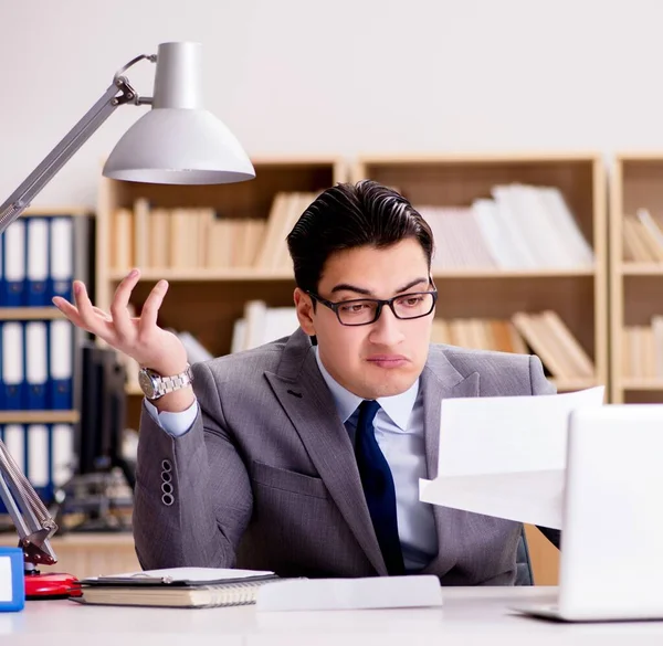 Businessman receiving letter envelope in office