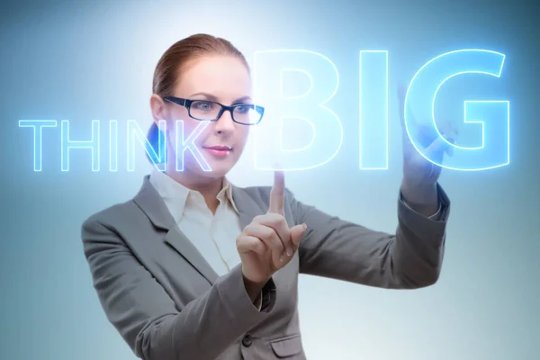 Think big concept with businesswoman — Stock Photo, Image