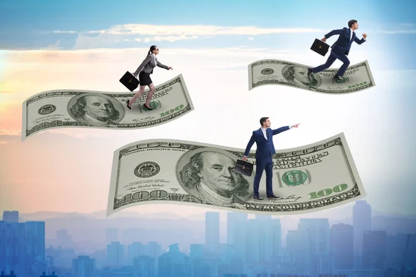 Business people flying on hundred dollar banknote — Stock Photo, Image