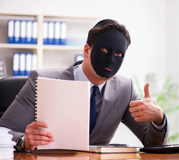 Businessman with mask in office hypocrisy concept — Stock Photo, Image