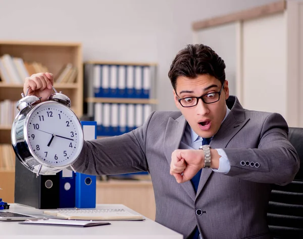 Businessman with clock failing to meet deadlines — Stock Photo, Image