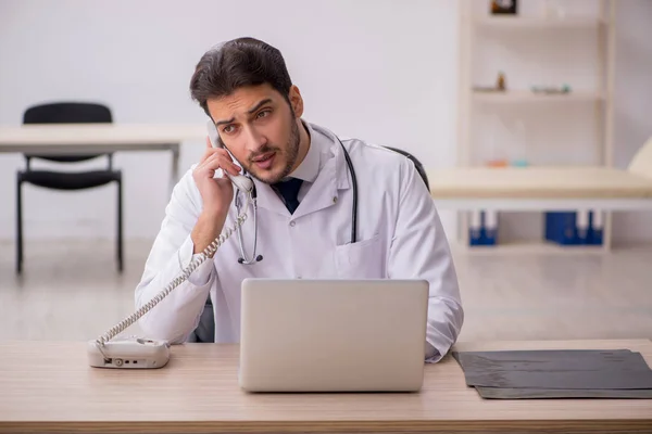 Young male doctor in telemedicine concept — Stock Photo, Image