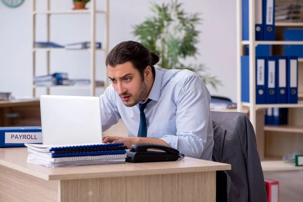 Young male bookkeeper working in the office — Stock Photo, Image