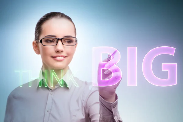 Think big concept with businesswoman — Stock Photo, Image