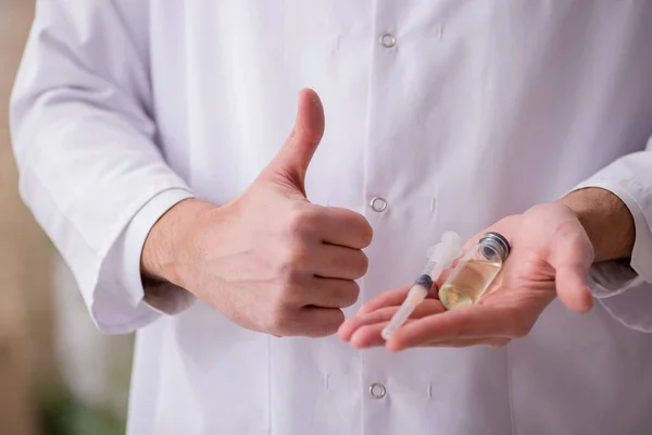 Young male doctor in vaccination concept — Stock Photo, Image