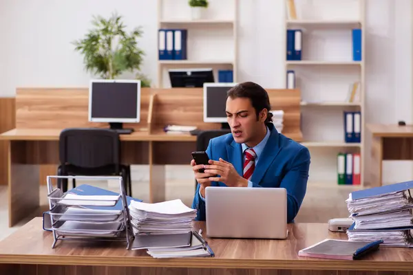 Young male employee working in the office — Stock Photo, Image