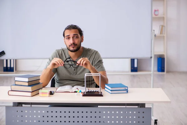 Young male student preparing for exams in the classroom — Stock Photo, Image