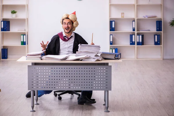 Funny young male employee magician and too much work in the office — Stock Photo, Image