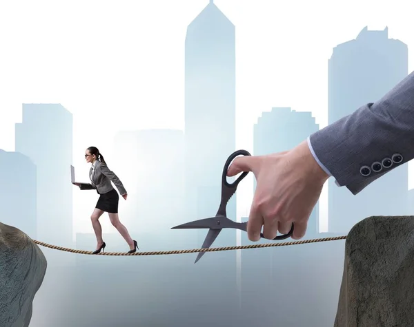 Hand cutting the rope under businesswoman tightrope walker — Stock Photo, Image