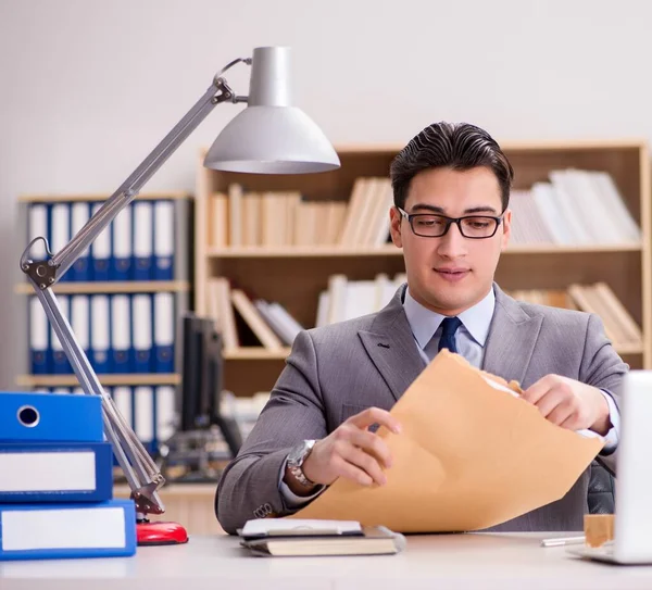 Businessman receiving letter in the office