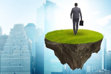 Yüzen adada iş adamı konsepti