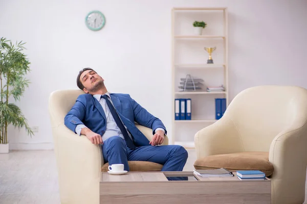 Young male employee waiting for business meeting — Stock Photo, Image