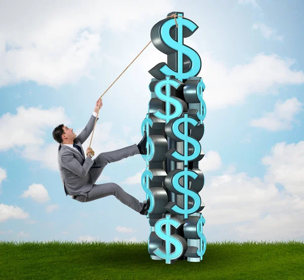 Businessman climbing dollar challenge tower — Stock Photo, Image