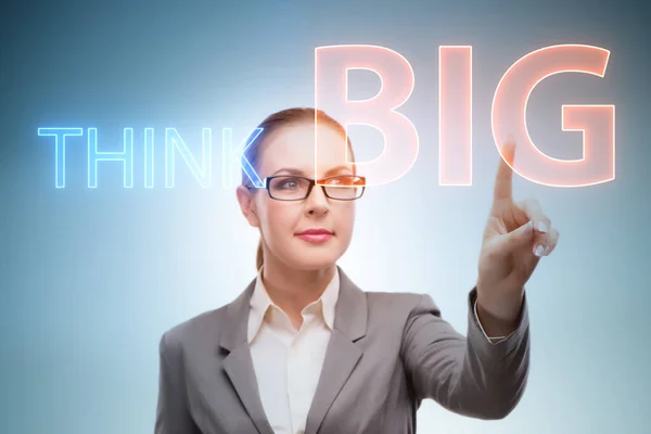 Think big concept with businesswoman — Stock Photo, Image