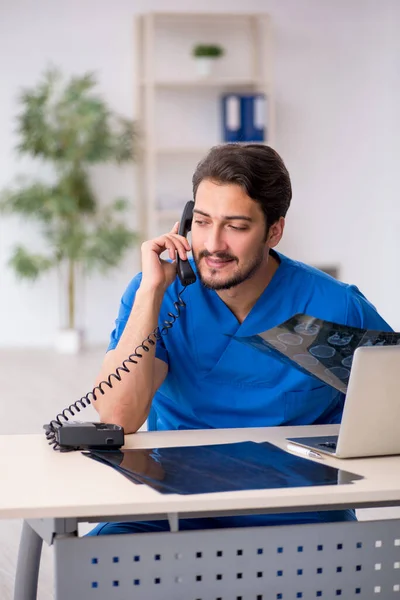 Young male doctor radiologist working in the clinic — Stock Photo, Image