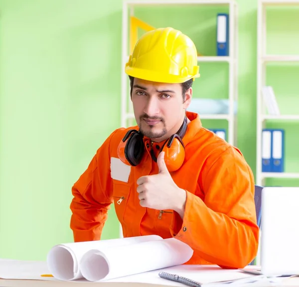 Construction supervisor planning new project in office