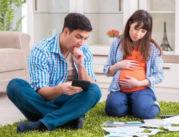 Young family in budget planning concept — Stock Photo, Image