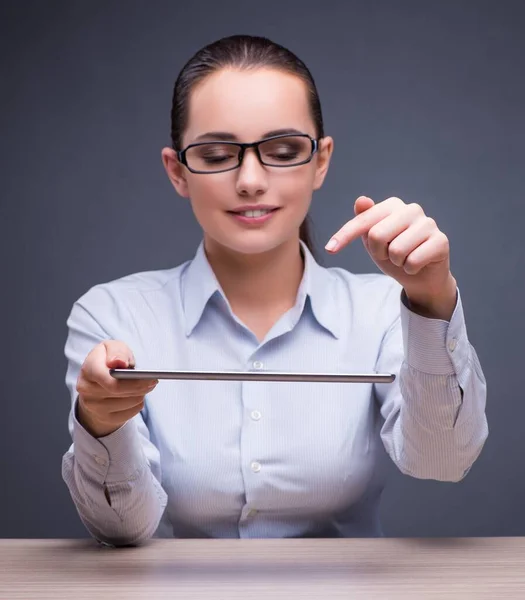 Businesswoman working with tablet computer in business concept — Stock Photo, Image