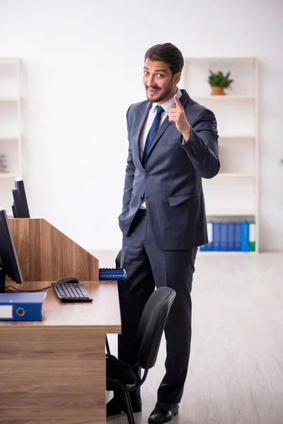 Young male employee working in the office — Stock Photo, Image