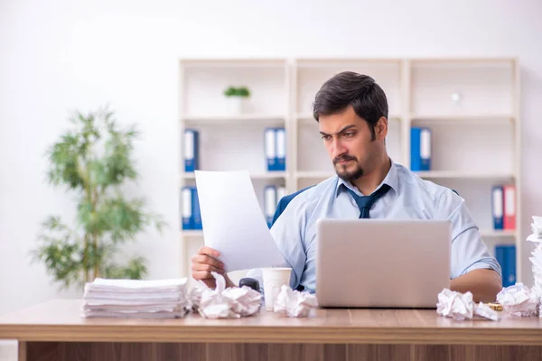 Young male employee rejecting new ideas in the office — Stock Photo, Image