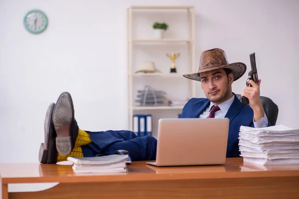 Young cowboy businessman working at workplace — Stock Photo, Image