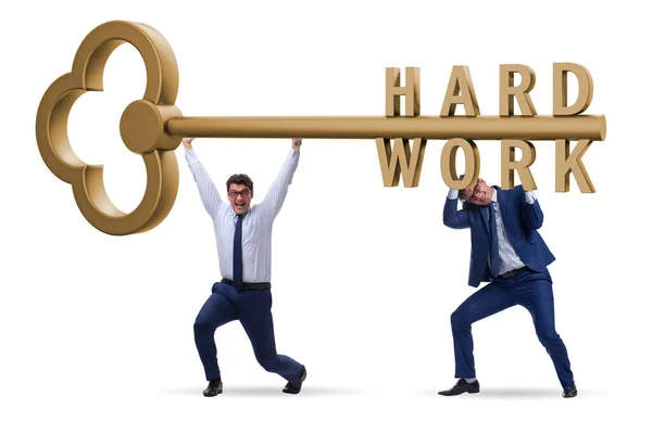 Concepto de trabajo duro con clave y hombre de negocios — Foto de Stock