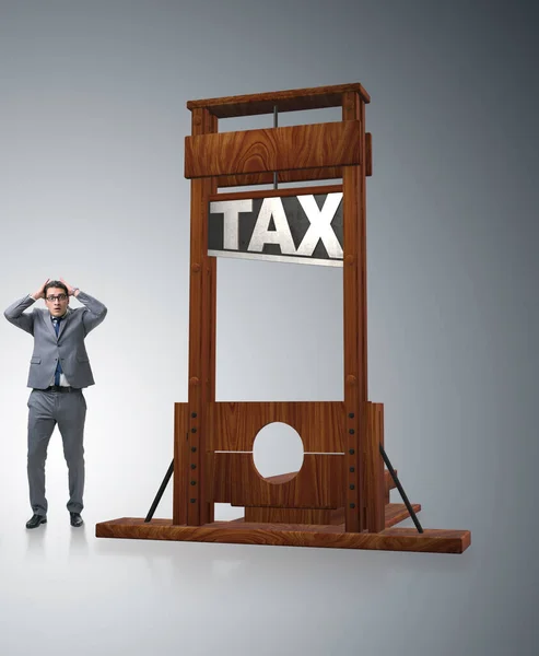 Empresario en concepto de negocio de altos impuestos pesados — Foto de Stock