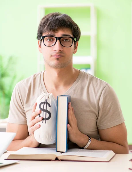 Young student in expensive tuition concept — Stock Photo, Image