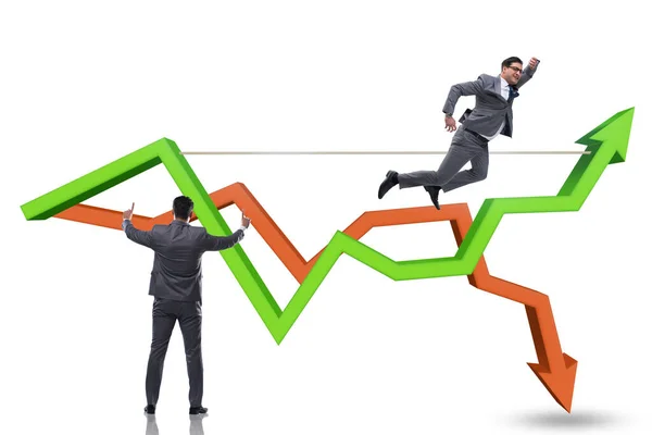 Businessman balancing on tightrope on line chart — Stock Photo, Image