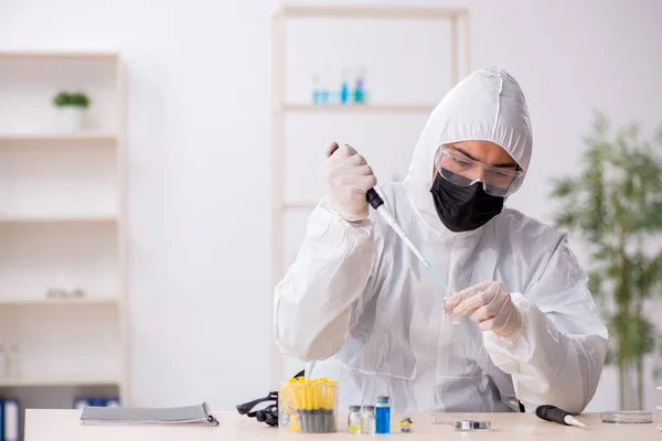 Young male chemist working at the lab during pandemic — Stock Photo, Image