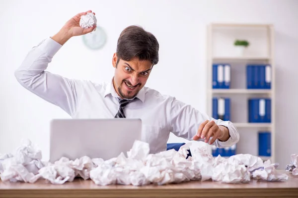 Young male employee in brainstorming concept — Stock Photo, Image