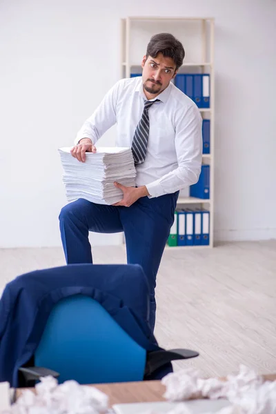 Young male employee in brainstorming concept — Stock Photo, Image